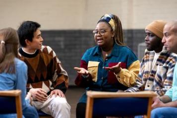 Group of people sat chatting.