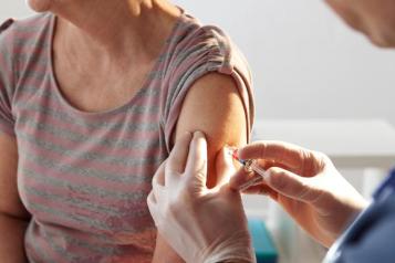 A healthcare professional providing a vaccine to a patient