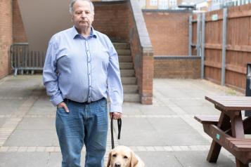 man with guide dog