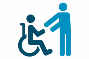 Two people - one in a wheelchair, one standing