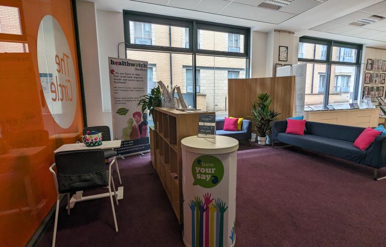 Photo of the Healthwatch Hub located on the ground floor of the Circle; the photo shows some sofas in the waiting area and the small table used for consultations