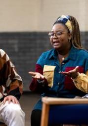 Group of people sat chatting.