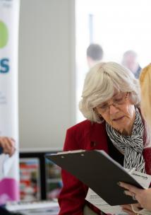 Healthwatch staff member speaking to a member of the public about their experience